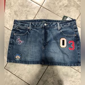 absolutely adorable jean skirt with embroidered patches